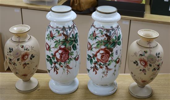 Pair of French 19th century opaline glass tall vases, decorated with rose sprays on a white ground and another pair of opaline vases